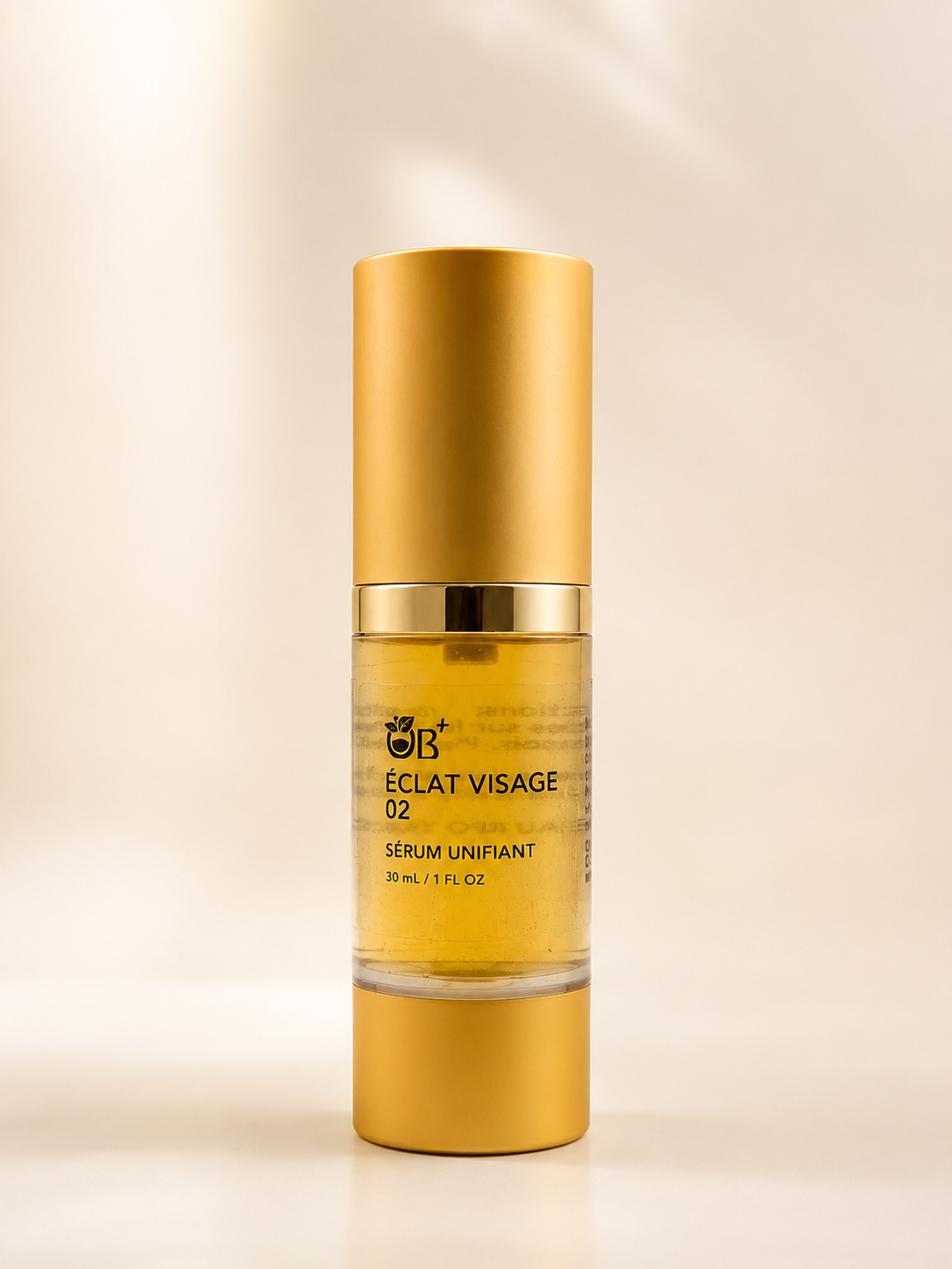 OB+ Éclat Visage 02 face serum bottle with a sleek design, highlighting its unifying and brightening skincare benefits.