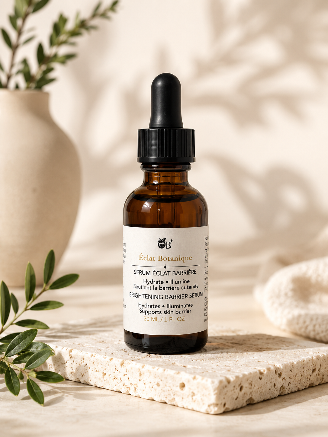 OB+ Éclat Botanique Brightening Barrier Serum in a sleek bottle, showcasing its elegant packaging for face skincare.